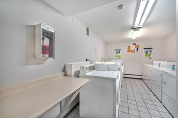 A laundromat with washers and dryers.